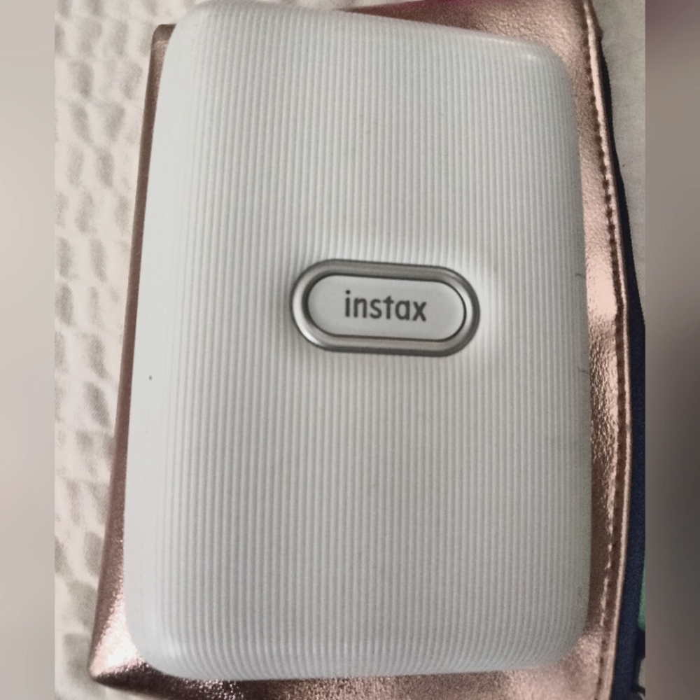 Instax, works well and instantly prints photos